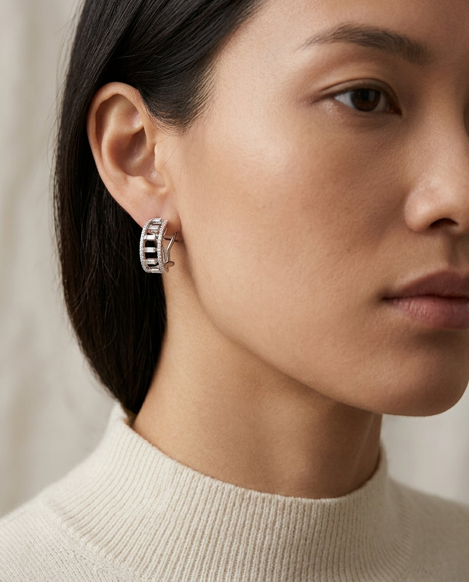 Diamond Baguette Open Step Omega Back Earrings In 18 Karat White Gold — editorial close-up