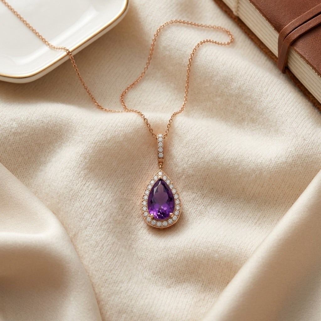 Amethyst and Diamond Pendant in 14k Rose Gold (13x8mm) — textile flat lay