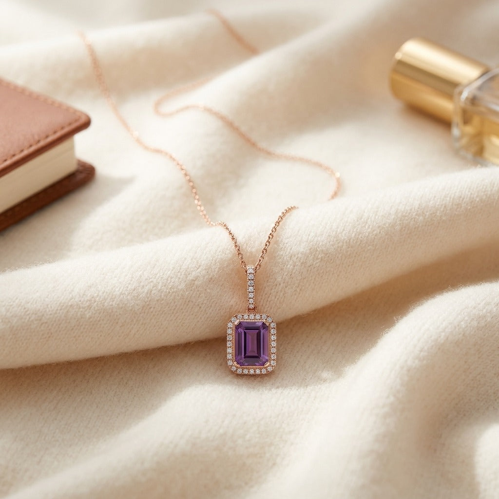 Amethyst And Diamond Emerald-cut Halo Pendant In 14k Rose Gold — textile flat lay