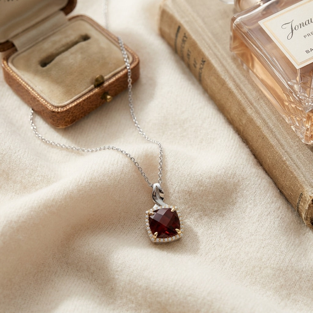 Garnet & Diamond Pendant In14k White & Yellow Gold — textile flat lay