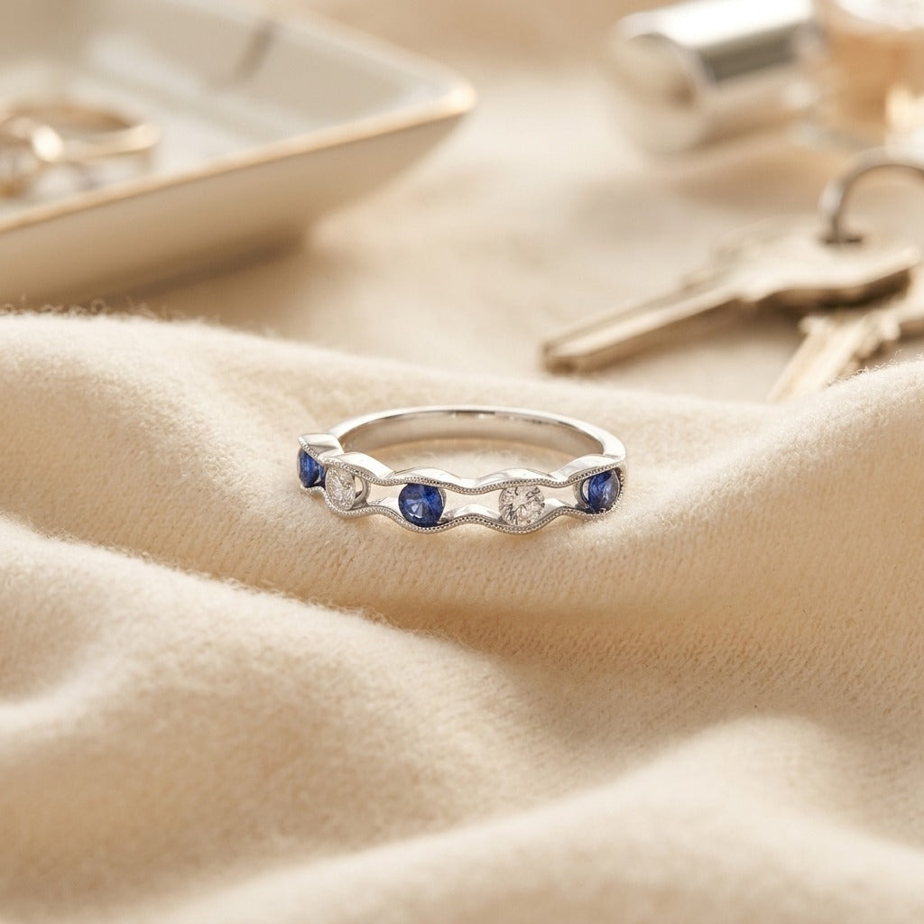 Floating Sapphire And Diamond Scallop Edge Band In 14k White Gold — textile flat lay