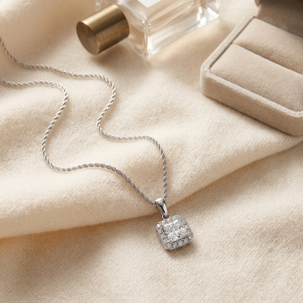 Blue Sapphire Asscher Halo Pendant in 14k White Gold 17-Inch Chain — textile flat lay