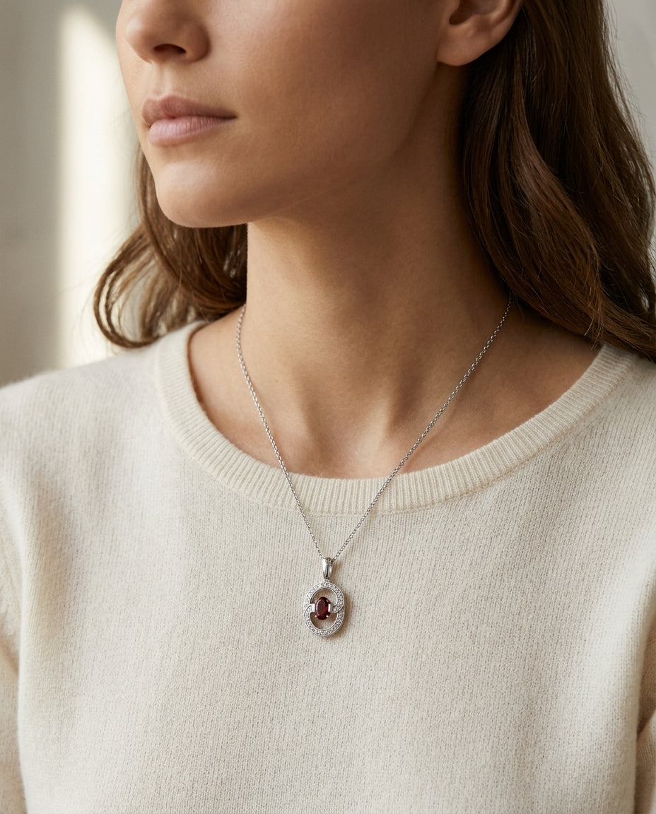 Garnet And Diamond Oval Swirl Pendant In 14k White Gold (17-in Curb Chain) — editorial close-up