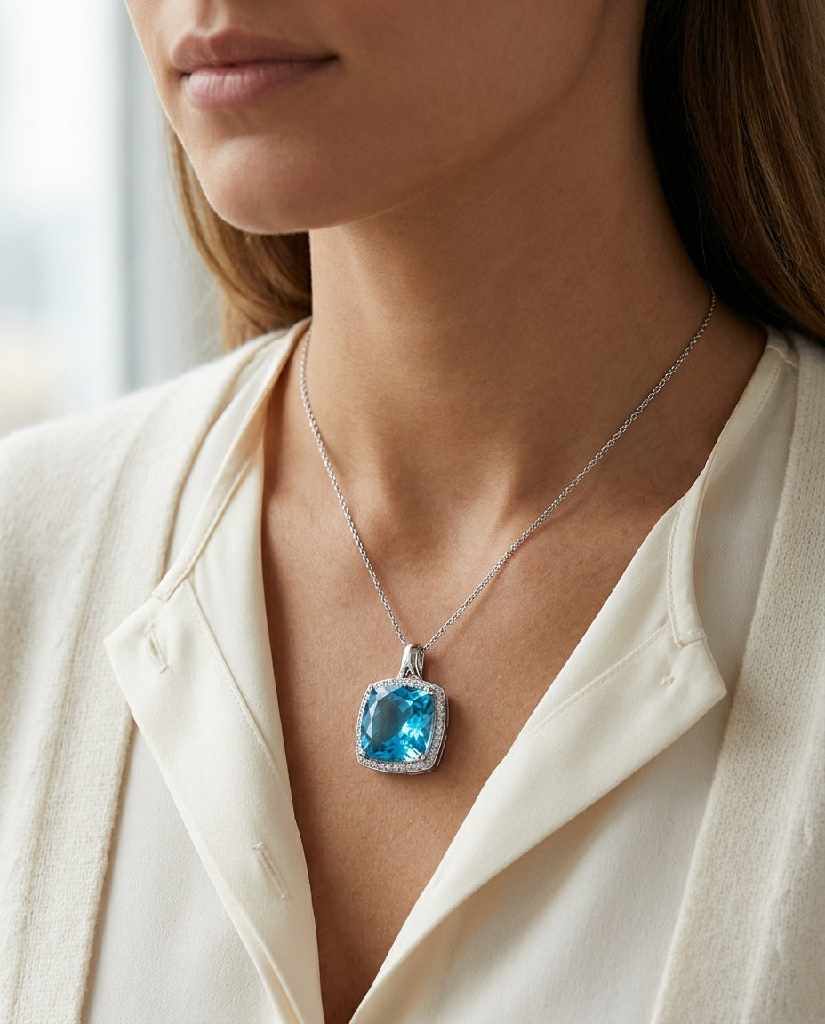 Blue Topaz And Diamond Checkerboard Cushion Halo Pendant In 14k White Gold (12mm Center) — editorial close-up