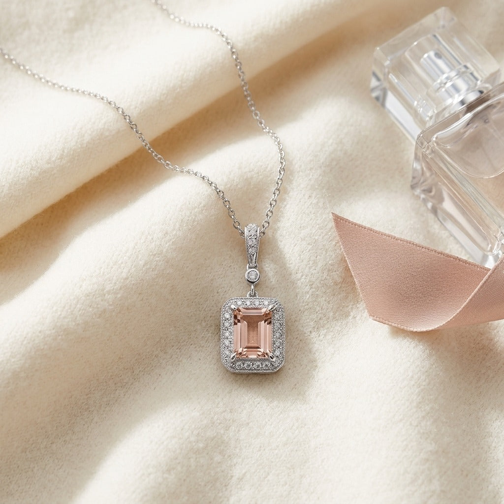 Morganite and Diamond Emerald Cut Halo Dangle Pendant in 14k White Gold (8x6mm Center) — textile flat lay