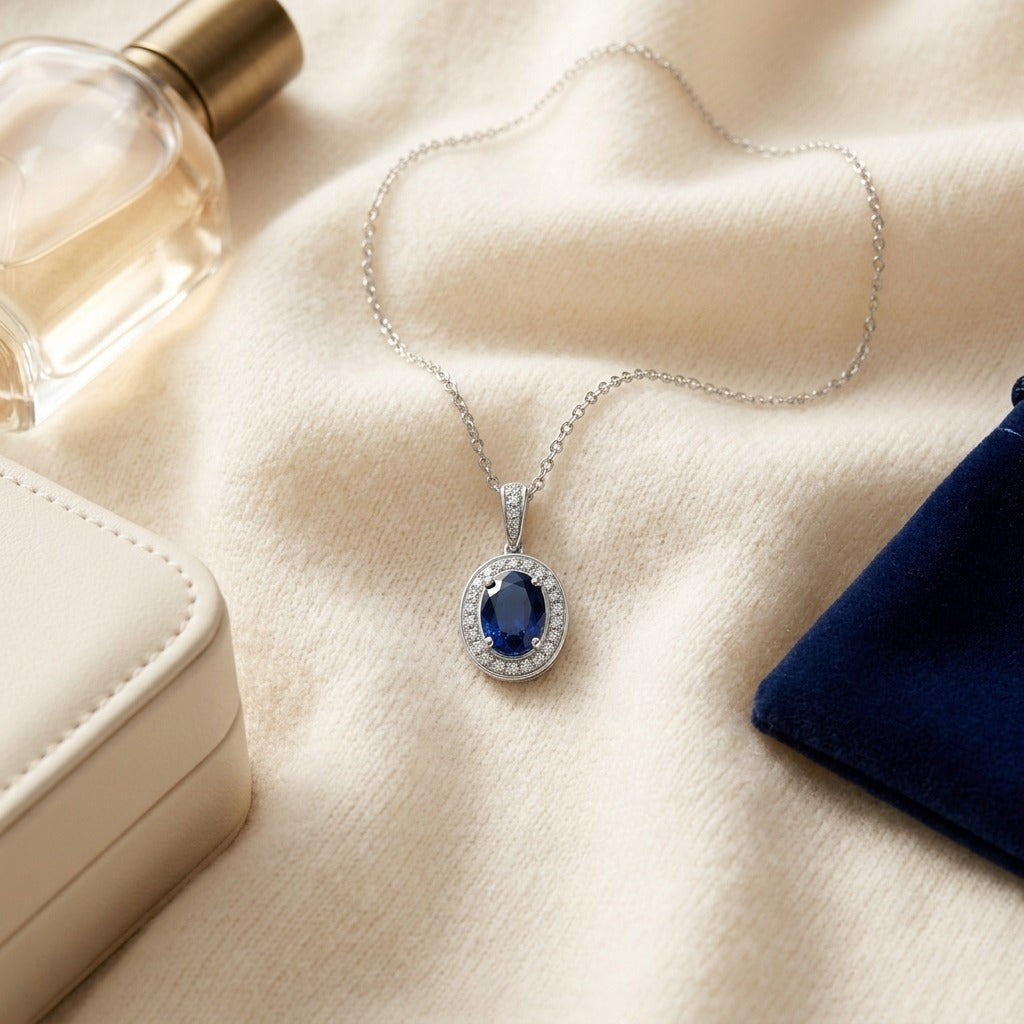 Sapphire and Diamond Pendant in 14k White Gold (1/6 Ct. Tw,) — textile flat lay