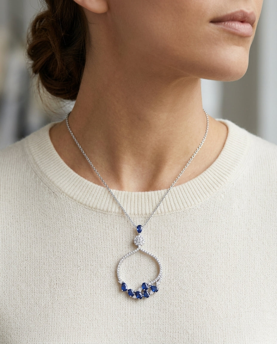 Sapphire And Diamond Cradle Pendant In 14k White Gold — editorial close-up