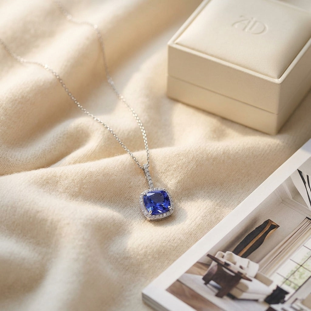 Cushion Tanzanite and Diamond Pave Pendant in 14k White Gold — textile flat lay
