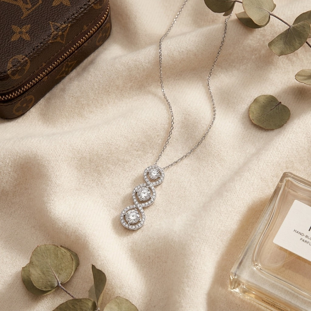 Pave Vertical Triple Infinity 3 Stone Pendant — textile flat lay