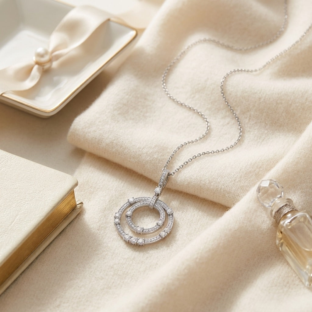 Diamond Circle in Circle Pendant in 14k White Gold 1/2ctw 16-17-18 Inch Adjustable Chain — textile flat lay