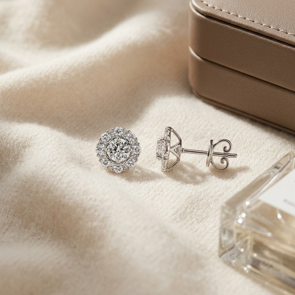 Diamond Halo Stud Earrings in 14k White Gold 1-1/3ctw — textile flat lay