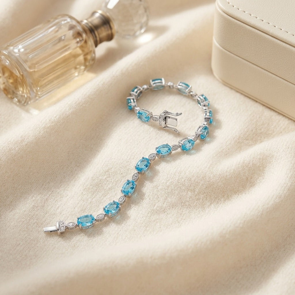 Blue Topaz Oval Half-Bezel and Diamond Pave East-West Bracelet in 14k White Gold (6x4mm) — textile flat lay
