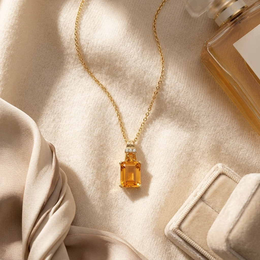 Citrine and Diamond Emerald Cut Pendant in 14k Yellow Gold (17-in Rolo Chain) — textile flat lay