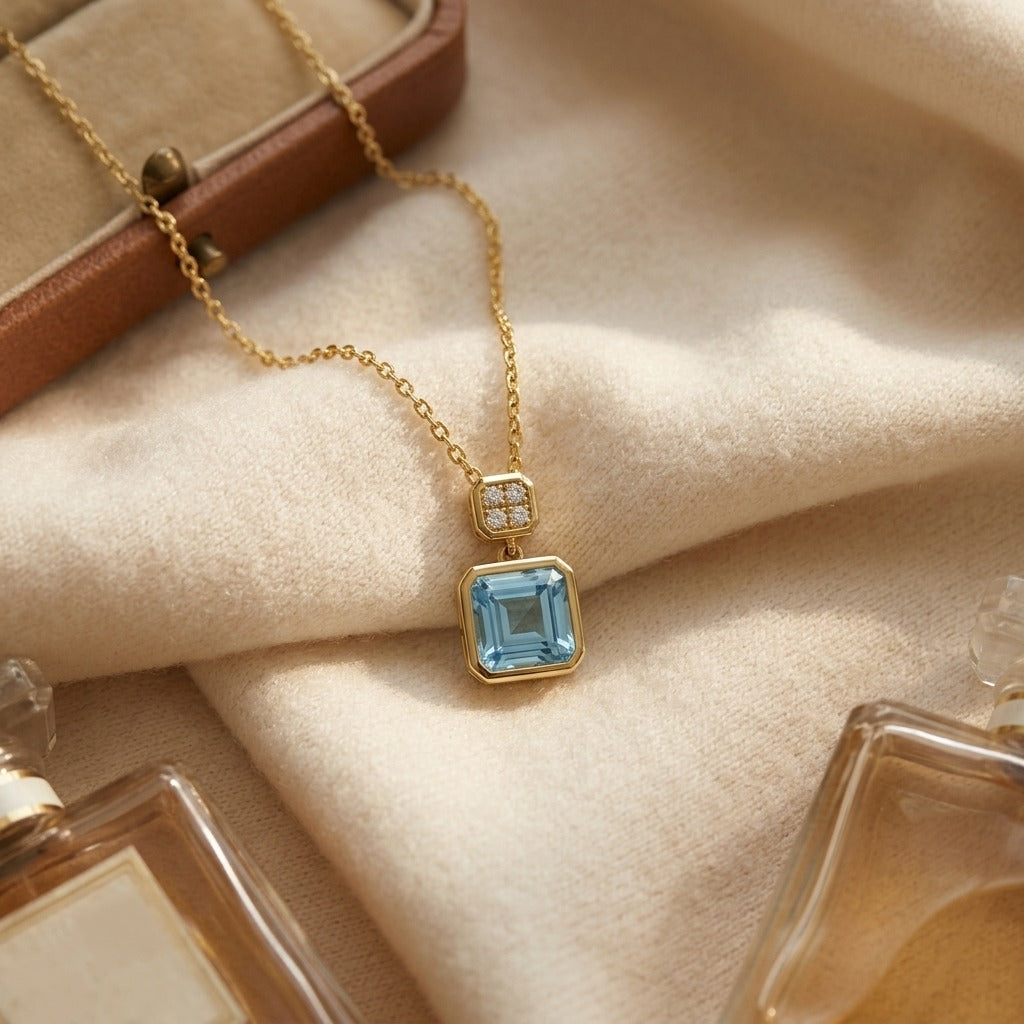Swiss Blue Topaz Bezel Pendant in 14k White Gold 0.04ctw — textile flat lay