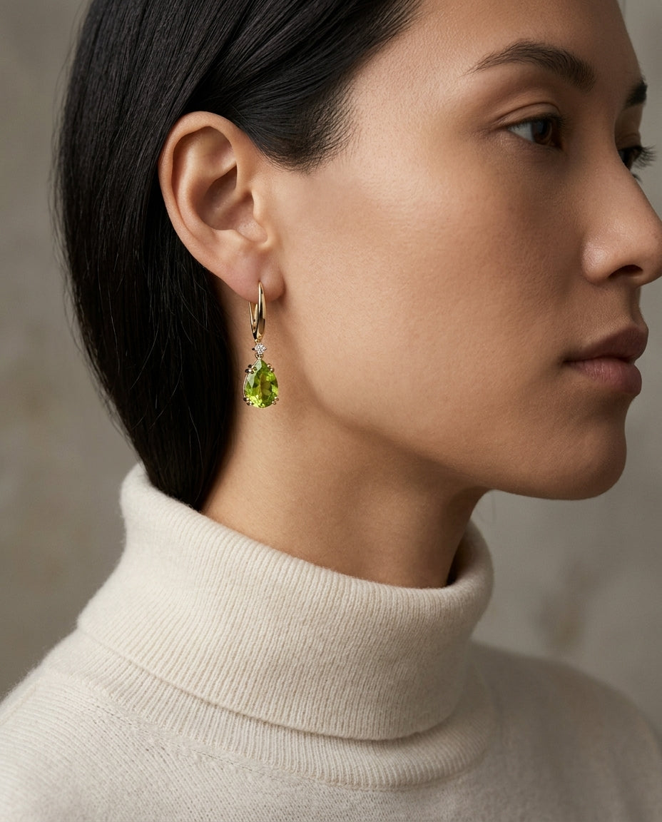 14k Yellow Gold Pear Shape Peridot With Diamond Accent — editorial close-up