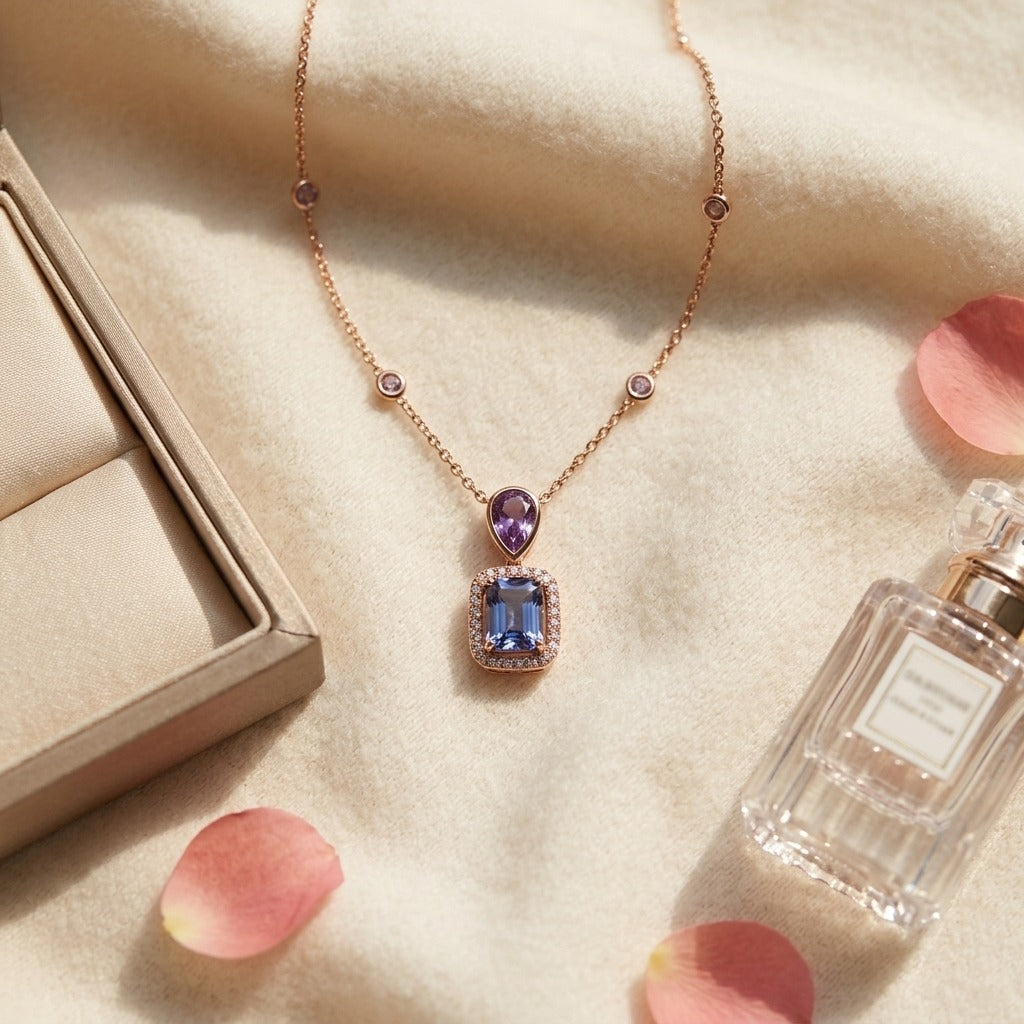 Blue Topaz and Diamond Dangle Cushion Halo Necklace in 14k Yellow Gold with 18 Inch Chain — textile flat lay