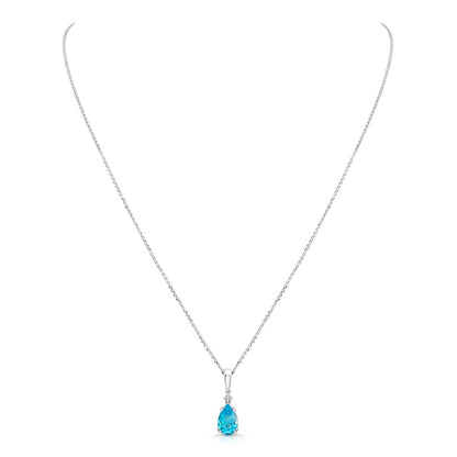 Blue Topaz And Diamond Pendant In 14k White Gold