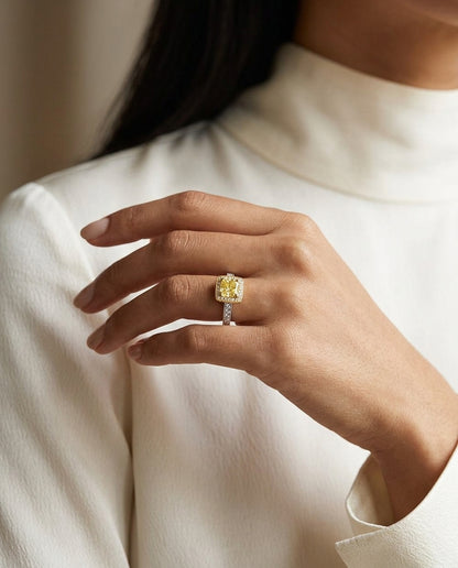 Prong Set Gia Certified Fancy Yellow Radiant Cut Diamond Engagement Ring In 18k Two Tone Gold — editorial close-up
