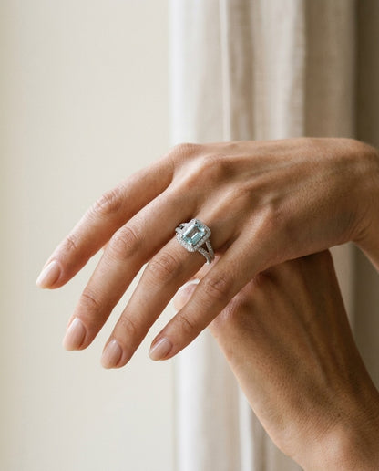 Aquamarine And Diamond Halo Ring — portrait close