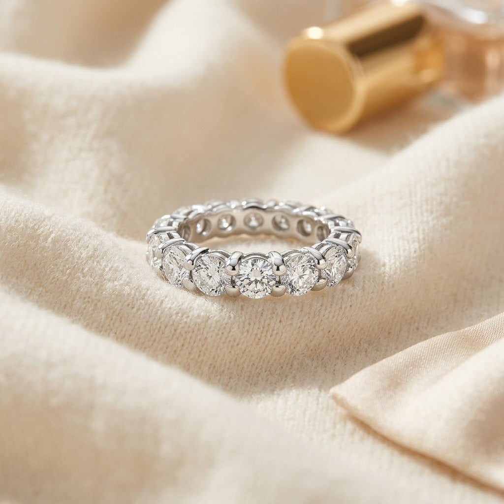 Round Diamond Eternity Band In 18k White Gold S:7.25 — textile flat lay