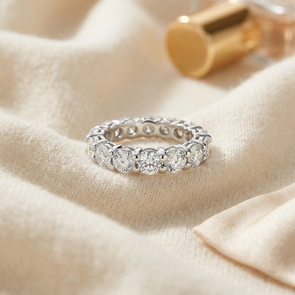 Round Diamond Eternity Band In 18k White Gold S:7.25 — textile flat lay