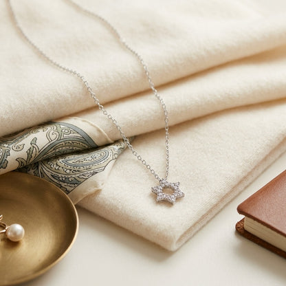 Diamond Star Of David Pendant In 18k White Gold — textile flat lay