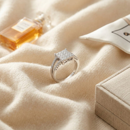 Diamond Princess Invisible-Set Square Center with Round Prong Split Shank in 18k White Gold — textile flat lay