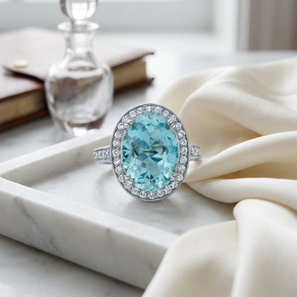 Aquamarine And Diamond Oval Halo Ring In 18k White Gold — atelier still life