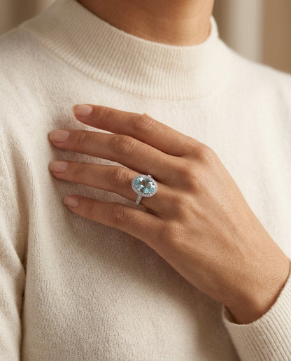 Aquamarine And Diamond Oval Halo Ring In 18k White Gold — editorial close-up