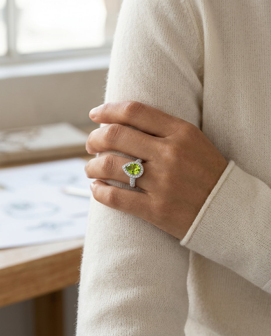 Peridot And Diamond Pear Shape Halo Ring In 18k White Gold 7/8ctw — editorial close-up