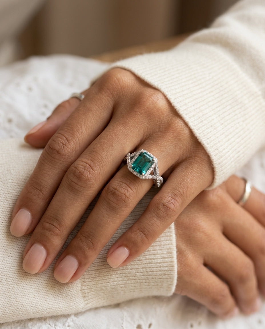 Created Emerald And Diamond Infinity Twist Ring In 18k White Gold — editorial close-up