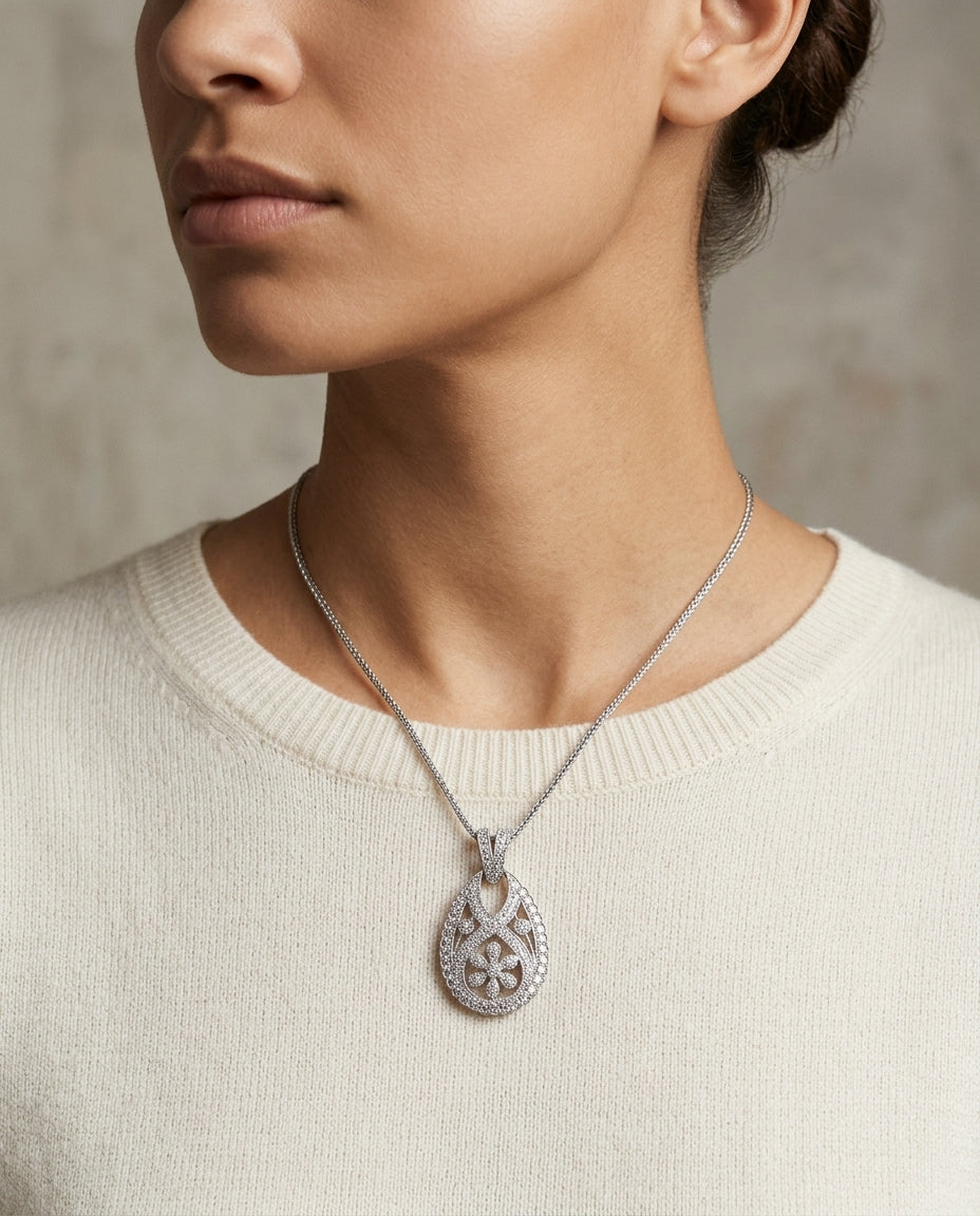 Diamond Open Teardrop Pendant With Millgrained Floral Motif In 18k White Gold — editorial close-up