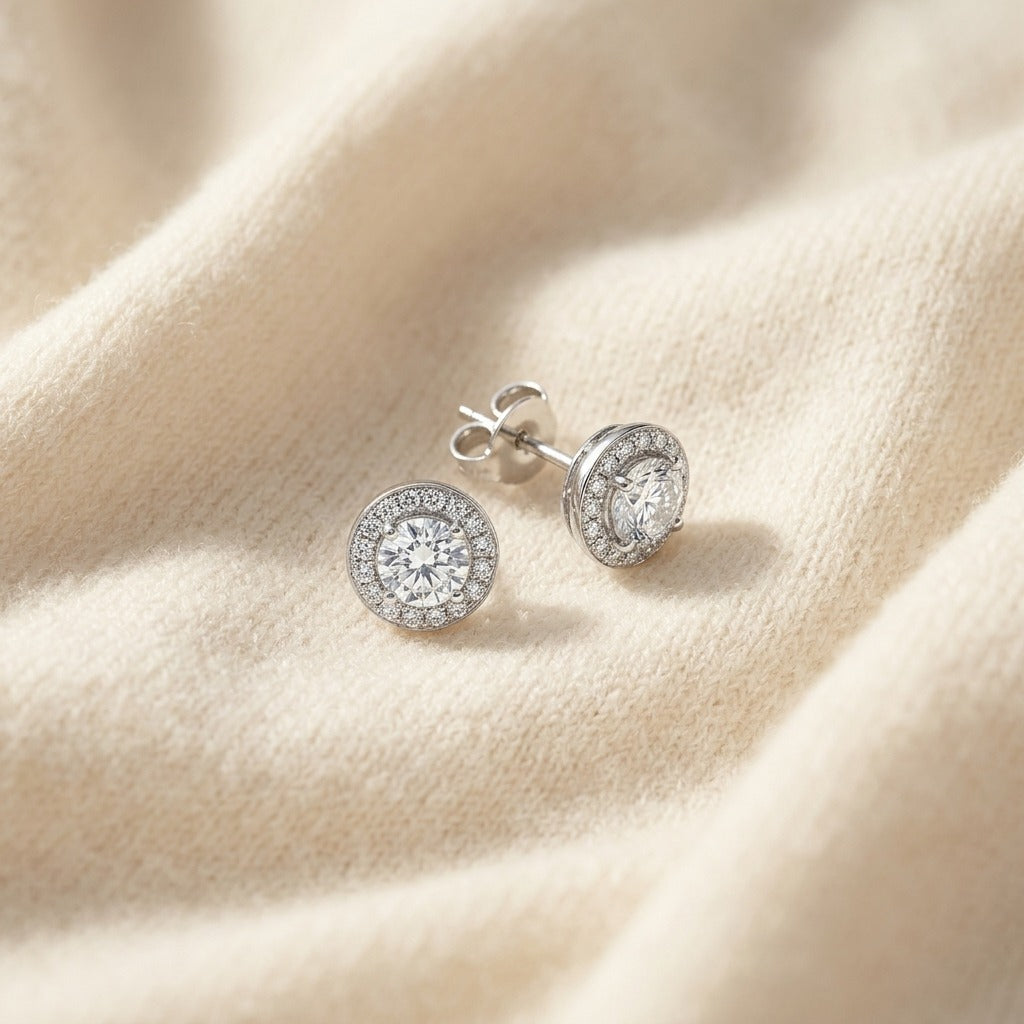 Diamond Round Halo Pendant with Diamond Bail and Studded Gallery in 18k White Gold — textile flat lay