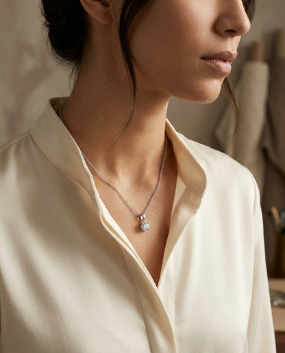 Diamond Round Solitaire Pendant (0.75ct) In 18k White Gold, 16 Inch — editorial close-up