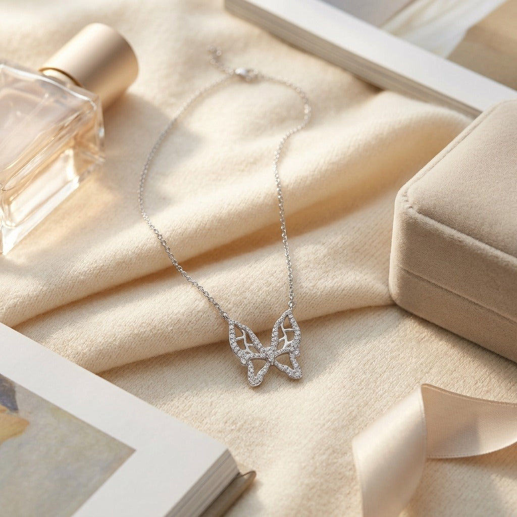 Diamond Floating Butterfly Necklace In 18k White Gold 1/10ctw 17in Cable Chain — textile flat lay