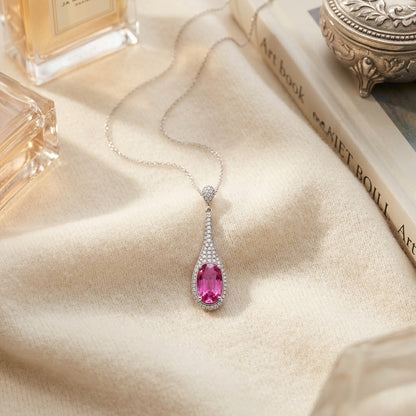 Pink Sapphire and Diamond Handmade Paddle Pendant in 18k White Gold — textile flat lay