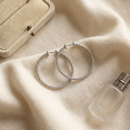 Diamond Hoop Earrings In 18k White Gold — textile flat lay