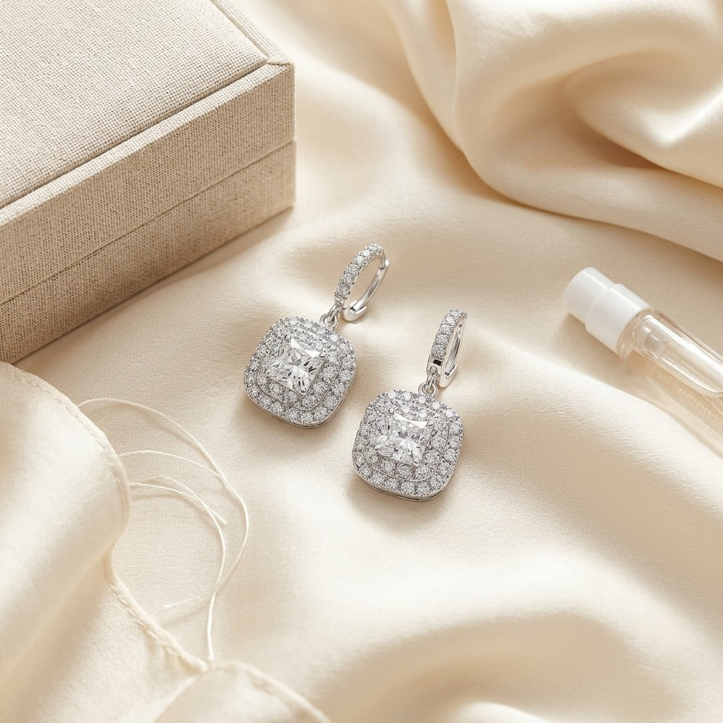 Diamond Cushion Double Halo Dangle Earrings In 18k White Gold — textile flat lay