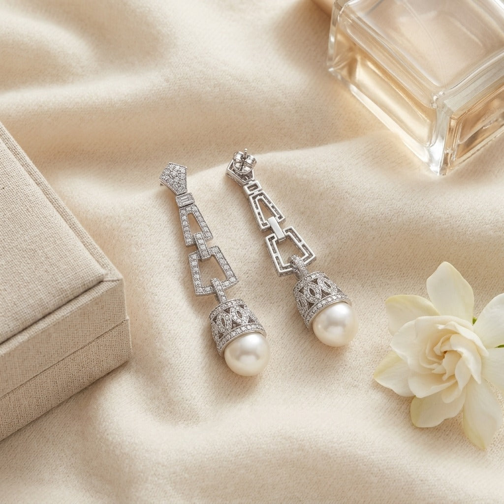 Pearl And Diamond Art Deco Dangle Earrings In 18k White Gold, Includes IGI Certificate — textile flat lay