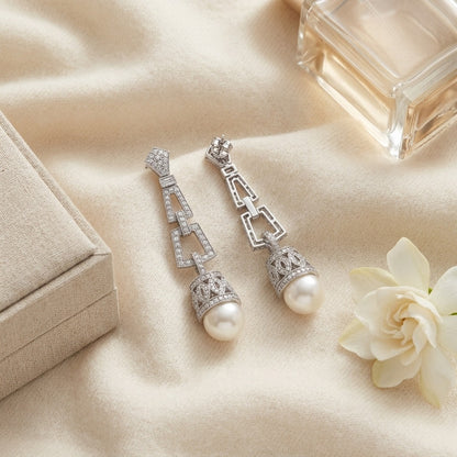 Pearl And Diamond Art Deco Dangle Earrings In 18k White Gold, Includes IGI Certificate — textile flat lay