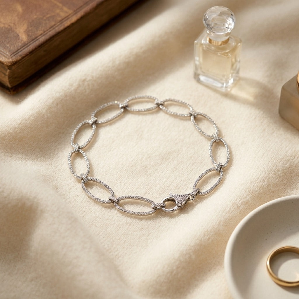 Diamond Pave Open Oval Link Bracelet in 18k White Gold (5-1/8 Ct.tw.) — textile flat lay