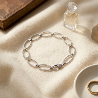 Diamond Pave Open Oval Link Bracelet in 18k White Gold (5-1/8 Ct.tw.) — textile flat lay