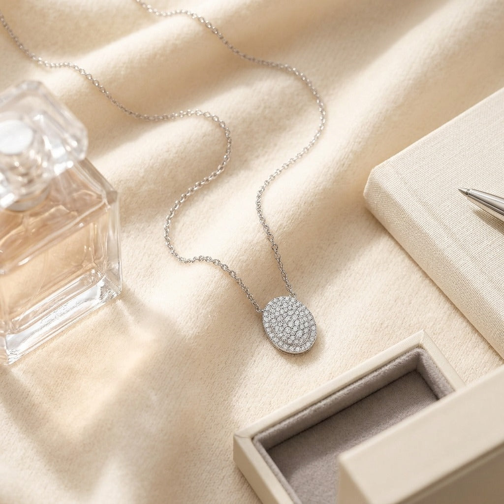 Diamond Pave Concave Oval Necklace In 18k White Gold 1/2ctw — textile flat lay