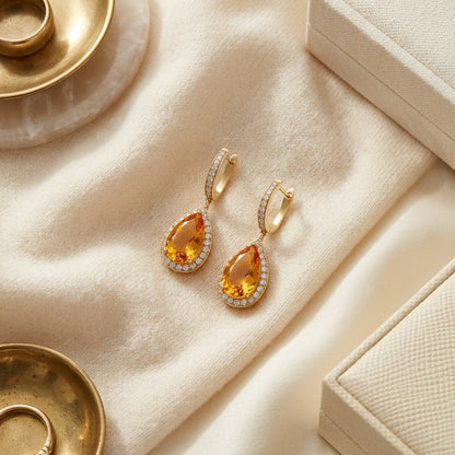 Citrine Pear And Diamond Halo Earrings In 18k Yellow Gold (1 1/6 Ct. Tw.) — textile flat lay
