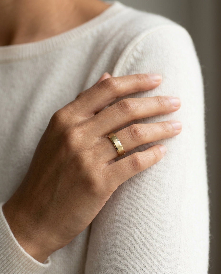 14k Yellow Gold 5mm Comfort Fit Matte Center, High Polish Beveled Edge Band — editorial close-up