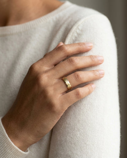 14k Yellow Gold 5mm Comfort Fit Matte Center, High Polish Beveled Edge Band — editorial close-up