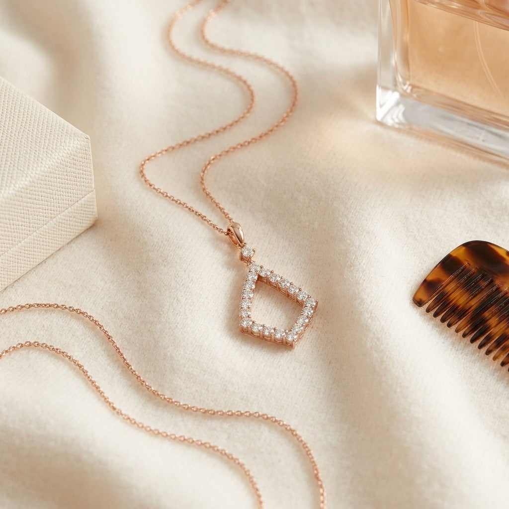 Diamond Elongated Diamond Shape Dangling Pendant in 14k Rose Gold (3/8 Ct. Tw.) — textile flat lay