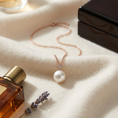 Freshwater Pearl and Diamond Pendant with Pave Bail in 14k Rose Gold (10mm) 16-18 Inch Chain — textile flat lay