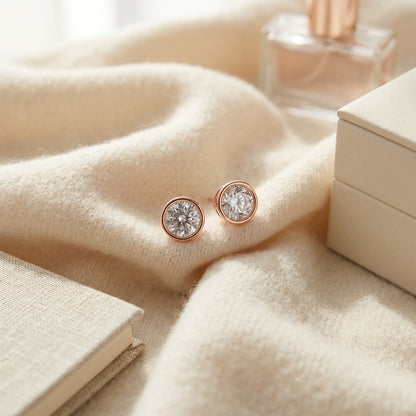 Diamond Round Bezel Stud Earrings in 14k Rose Gold (3/4 Ct.tw.) — textile flat lay