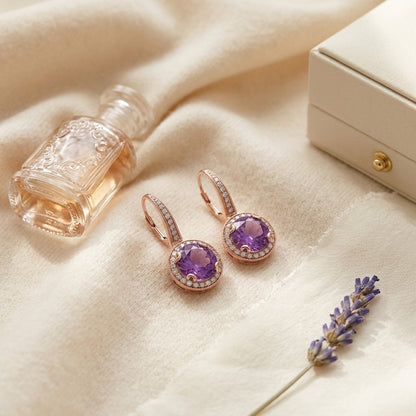 Amethyst And Diamond Round Halo Antique Finish Dangle Earrings In 14k Rose Gold ( Hi / Si ) — textile flat lay